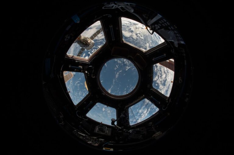 Astronaut conducting extravehicular activity in deep orbit