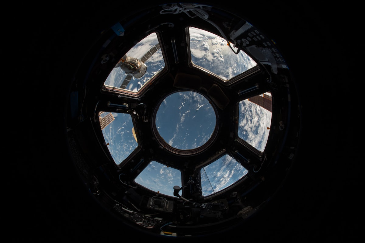 Astronaut conducting extravehicular activity in deep orbit